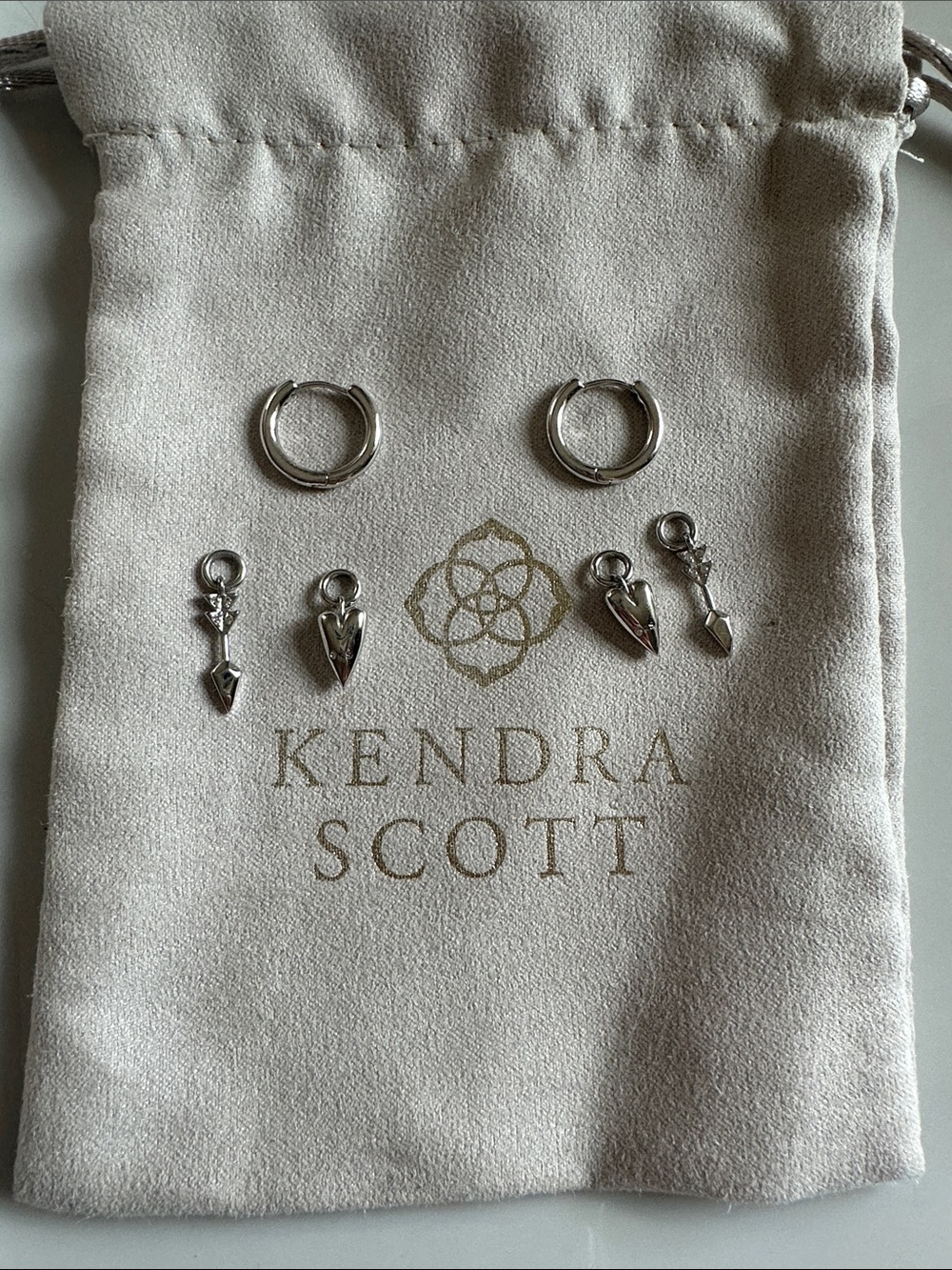 Kendra Scott Silver Huggie Hoop Earrings with Arrow and Heart Charms